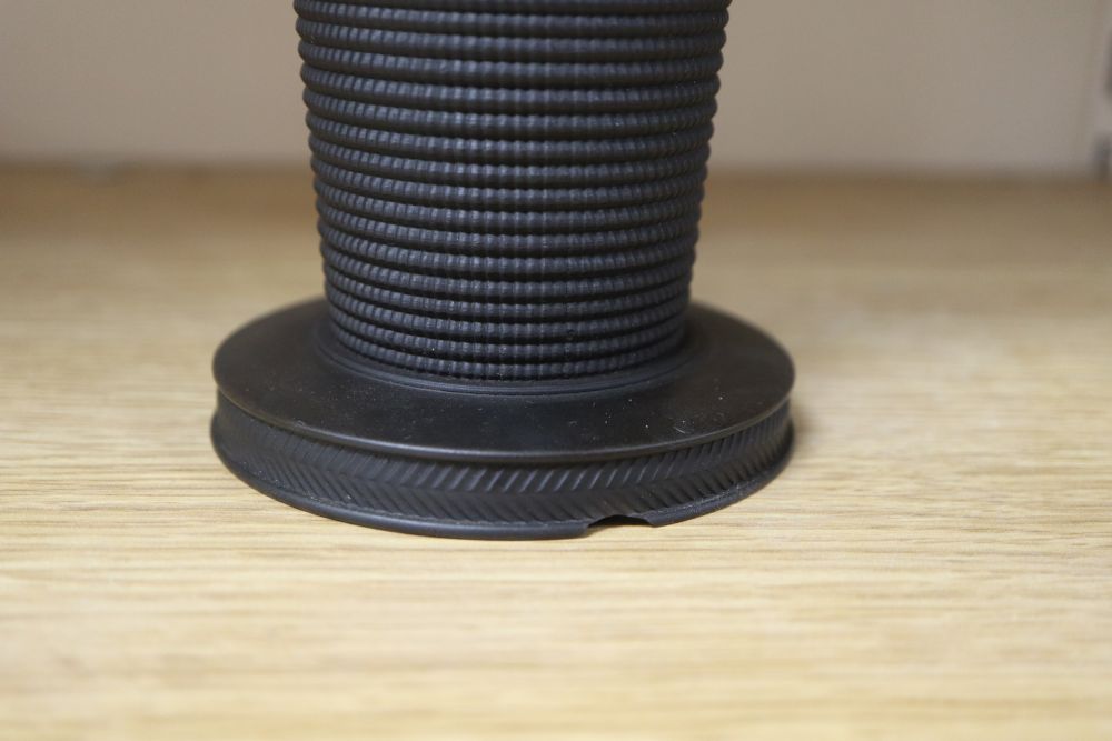 An Asprey silver mounted match-strike, a Wedgwood jar and a Wedgwood black basalt jar (3)